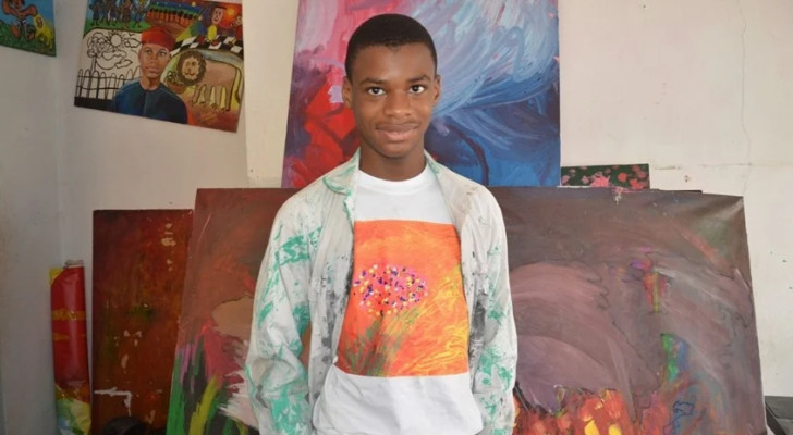 بريشته العملاقة... فتى نيجيري مصاب بالتوحد يرسم أكبر لوحة قماشية في العالم!